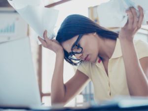 Woman struggling with paperwork